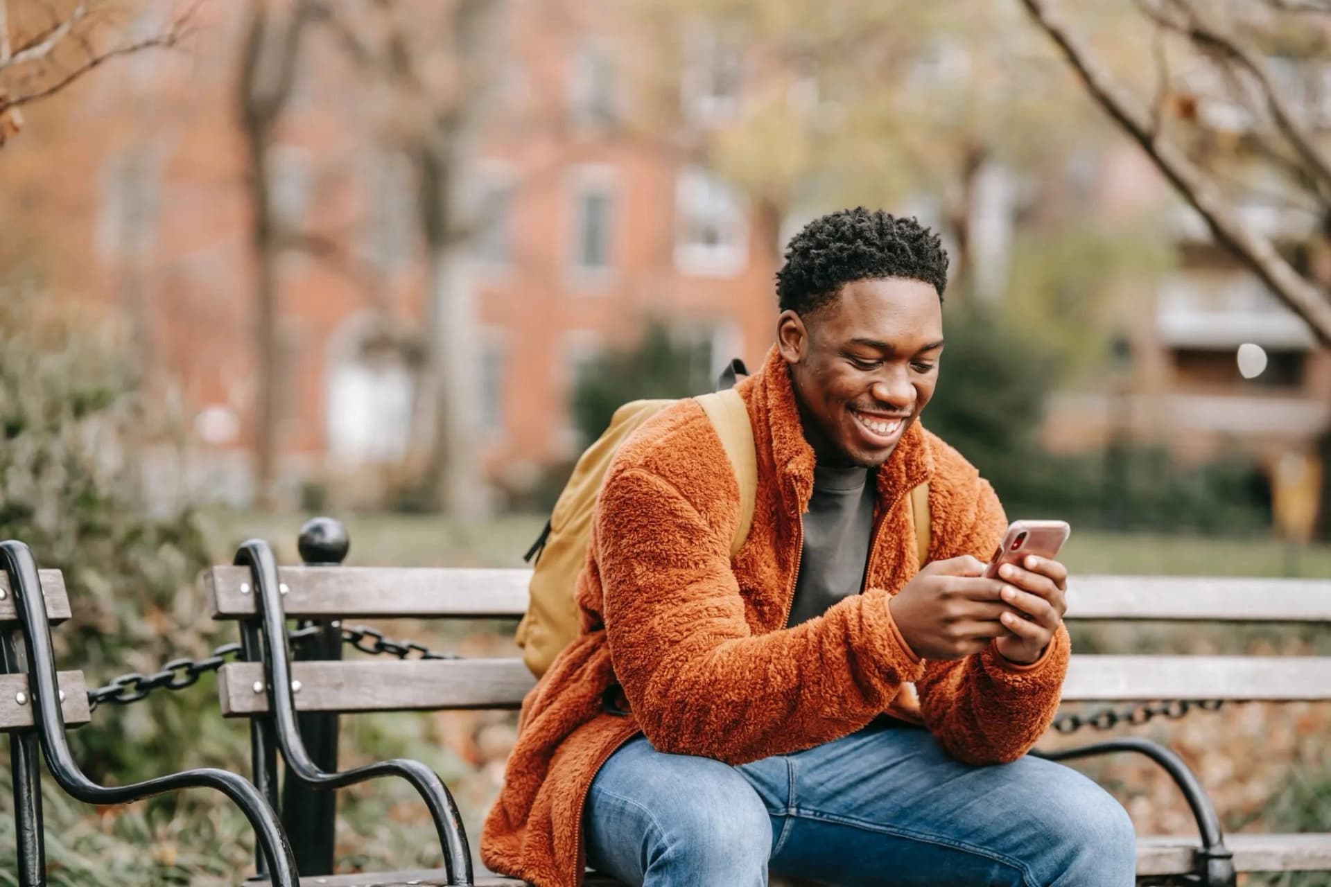 Happy man looking at phone